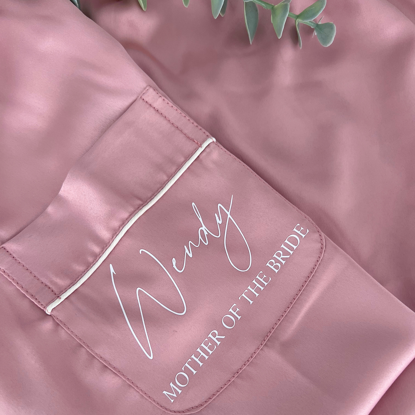 CLOSE UP OF DUSTY PINK LUXURY SATIN BRIDAL PYJAMAS